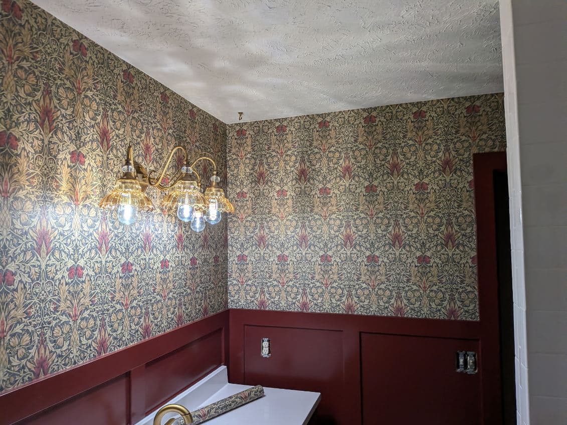 Rich William Morris-style wallcovering installed corner to corner